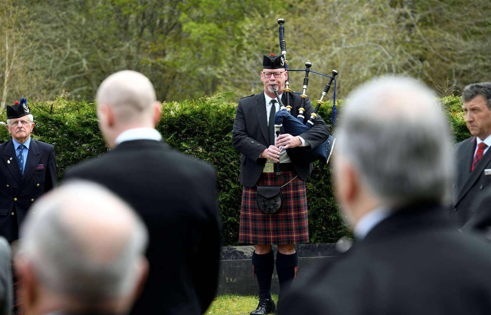 Niall Matheson plays at the graveside.