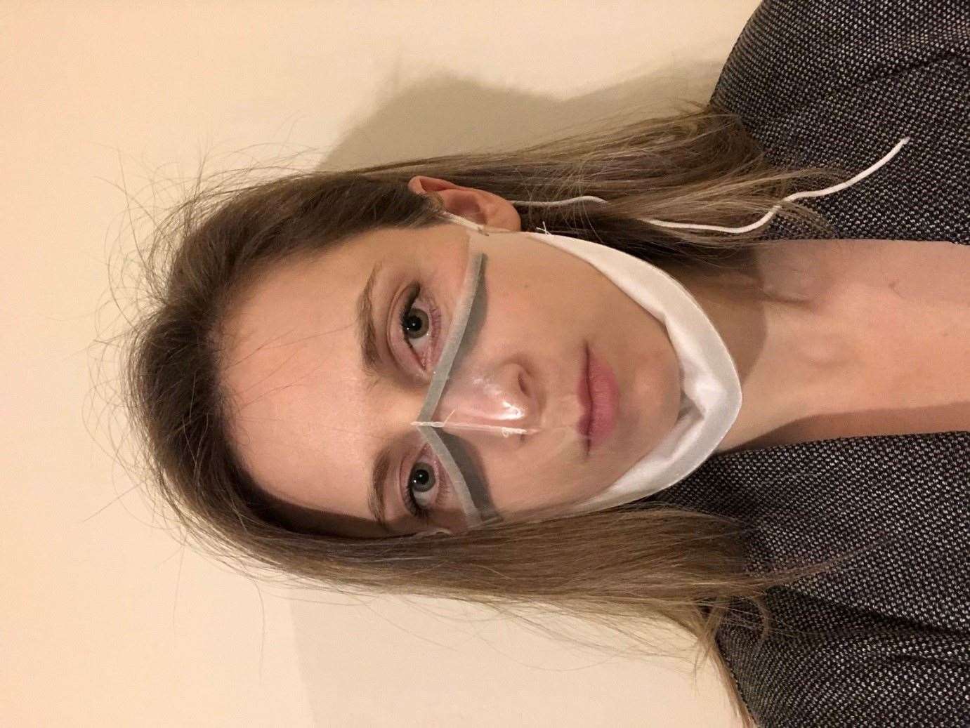 Design and innovation engineer Abi Bush demonstrates the new see-through mask (Cambridge University Hospitals/PA)