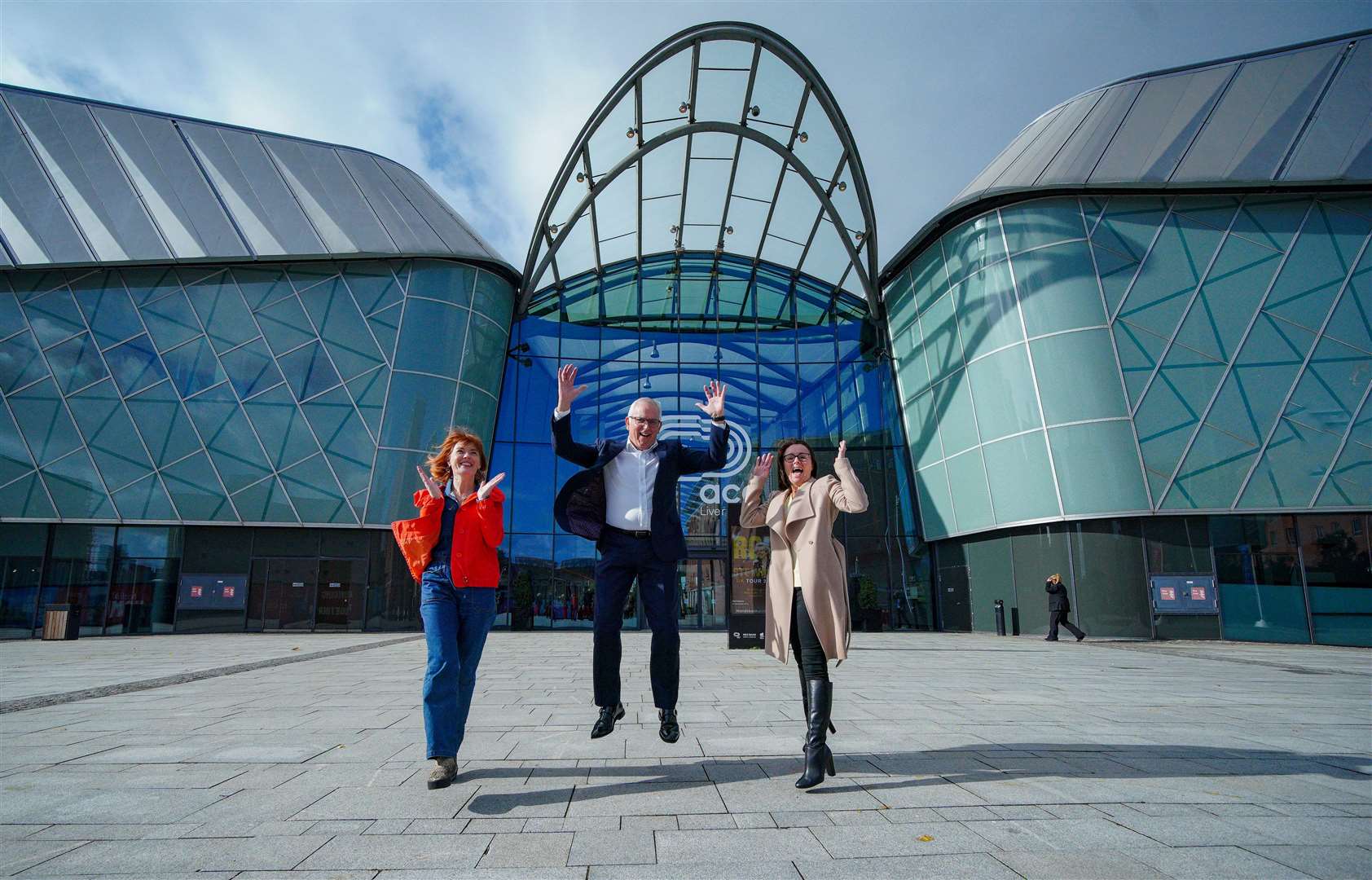 Claire McColgan, director of Culture Liverpool, Bill Addy, chief executive at the Liverpool Bid Company and Faye Dyer, managing director of the ACC Group, celebrating outside Liverpool M&S Arena after the city was announced as host of 2023 Eurovision Song Contest (Peter Byrne/PA)