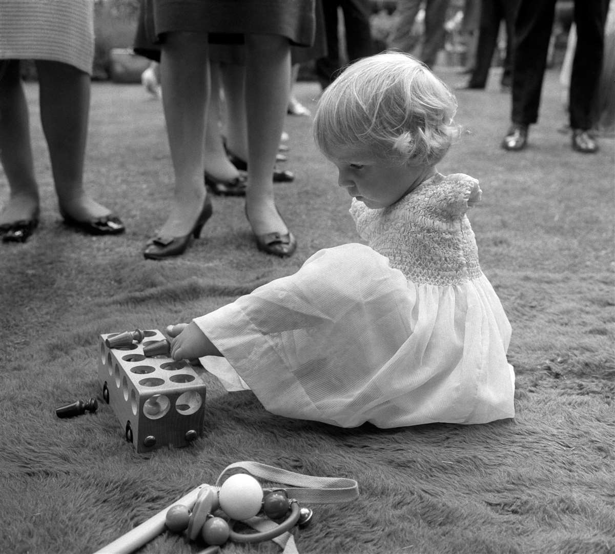 Phillipa Bradbourne, a baby born without arms as a result of Thalidomide, at a party in the 1960s (PA)