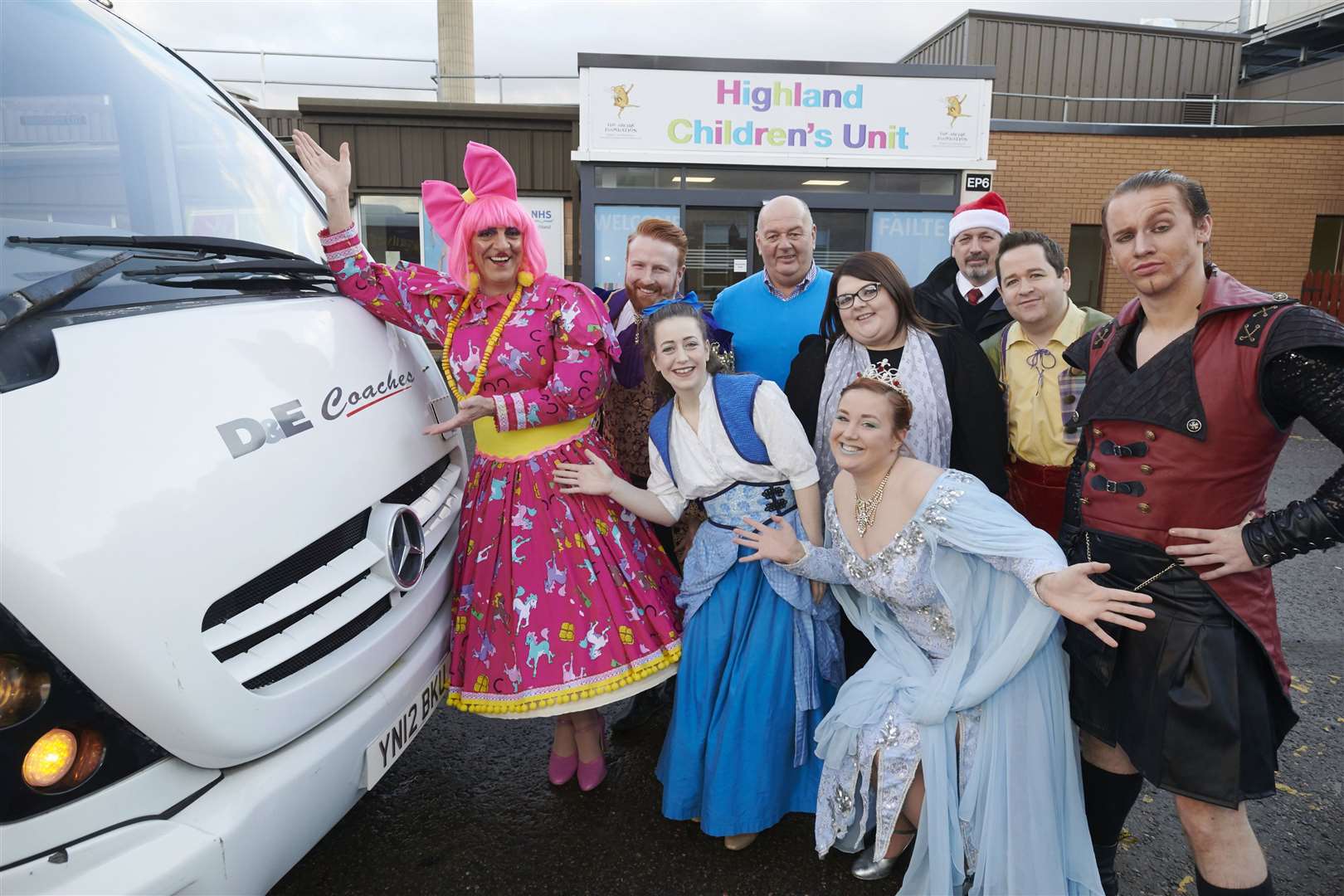 The panto cast with D & E MD Donald Mathieson arrive at Raigmore Hospital.