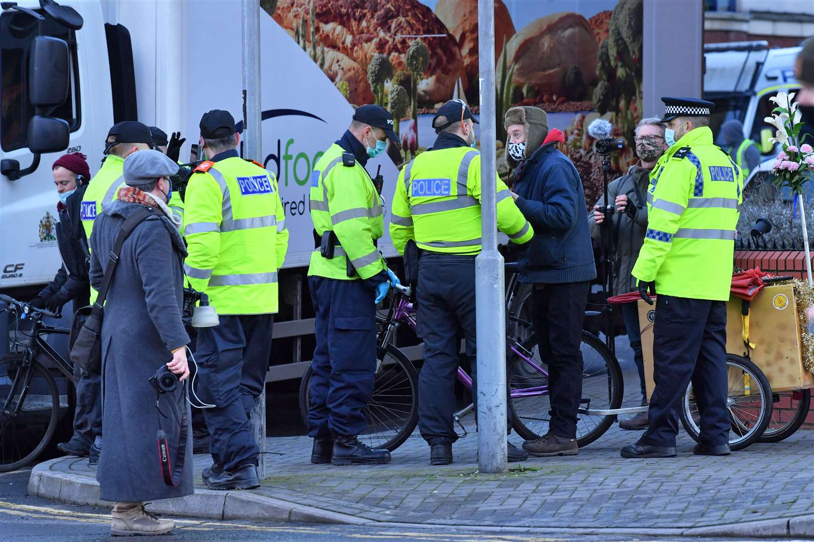 Police detain the four protesters outside Bristol Magistrates’ Court (Ben Birchall/PA)