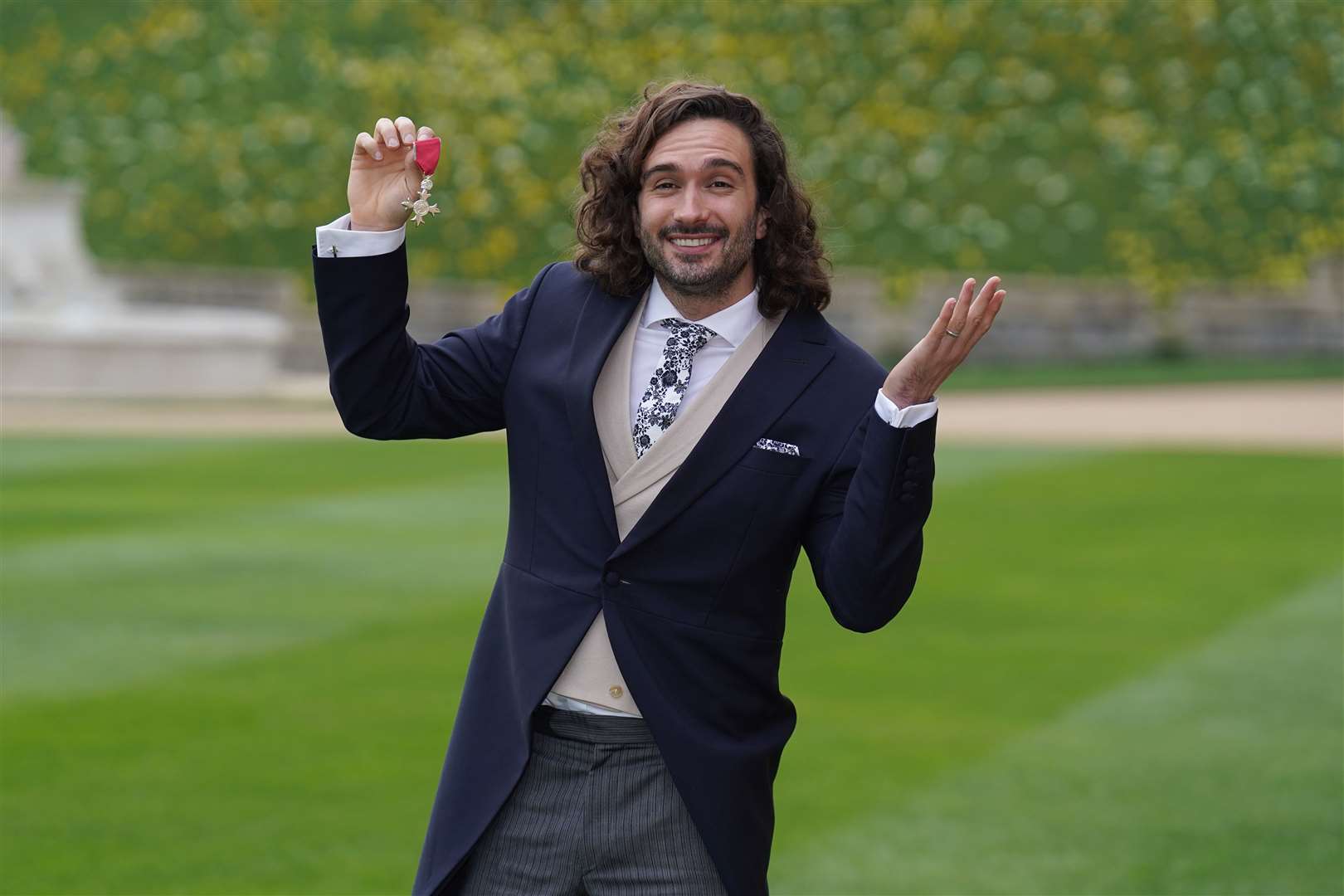 Joe Wicks after receiving his MBE medal from the Prince of Wales (Steve Parsons/PA)
