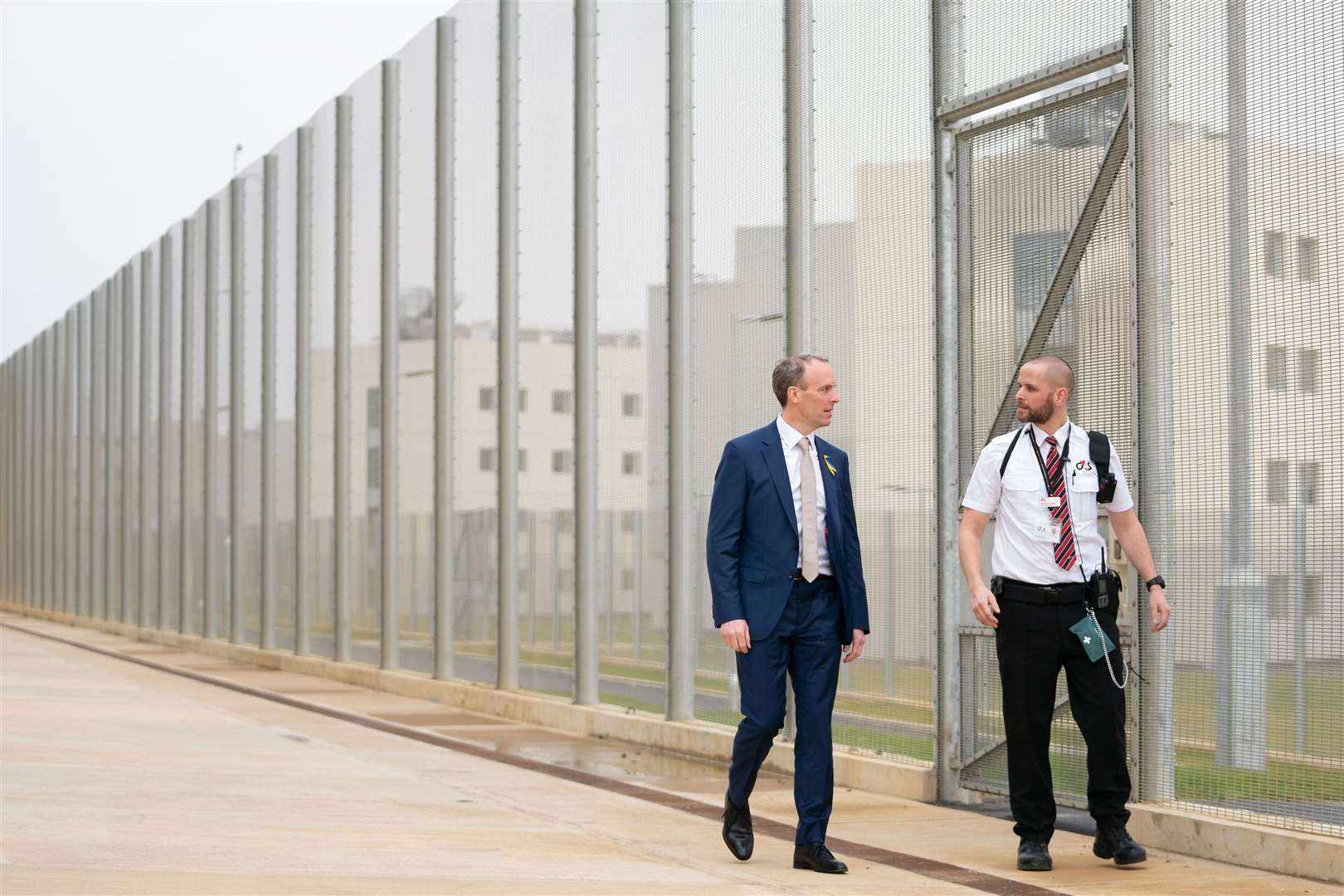 Deputy Prime Minister and Justice Secretary Dominic Raab with a prison officer at the opening of HMP Five Wells in Wellingborough in March (Joe Giddens/PA)