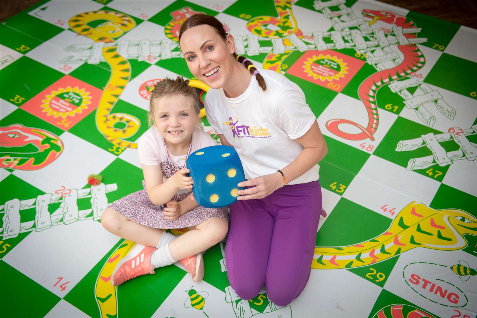 Playing snakes and ladders at the Summer Kids Club at the Eastgate Shopping Centre are Harriett Urquhart and Amy Mullen. Pictures: Callum Mackay.