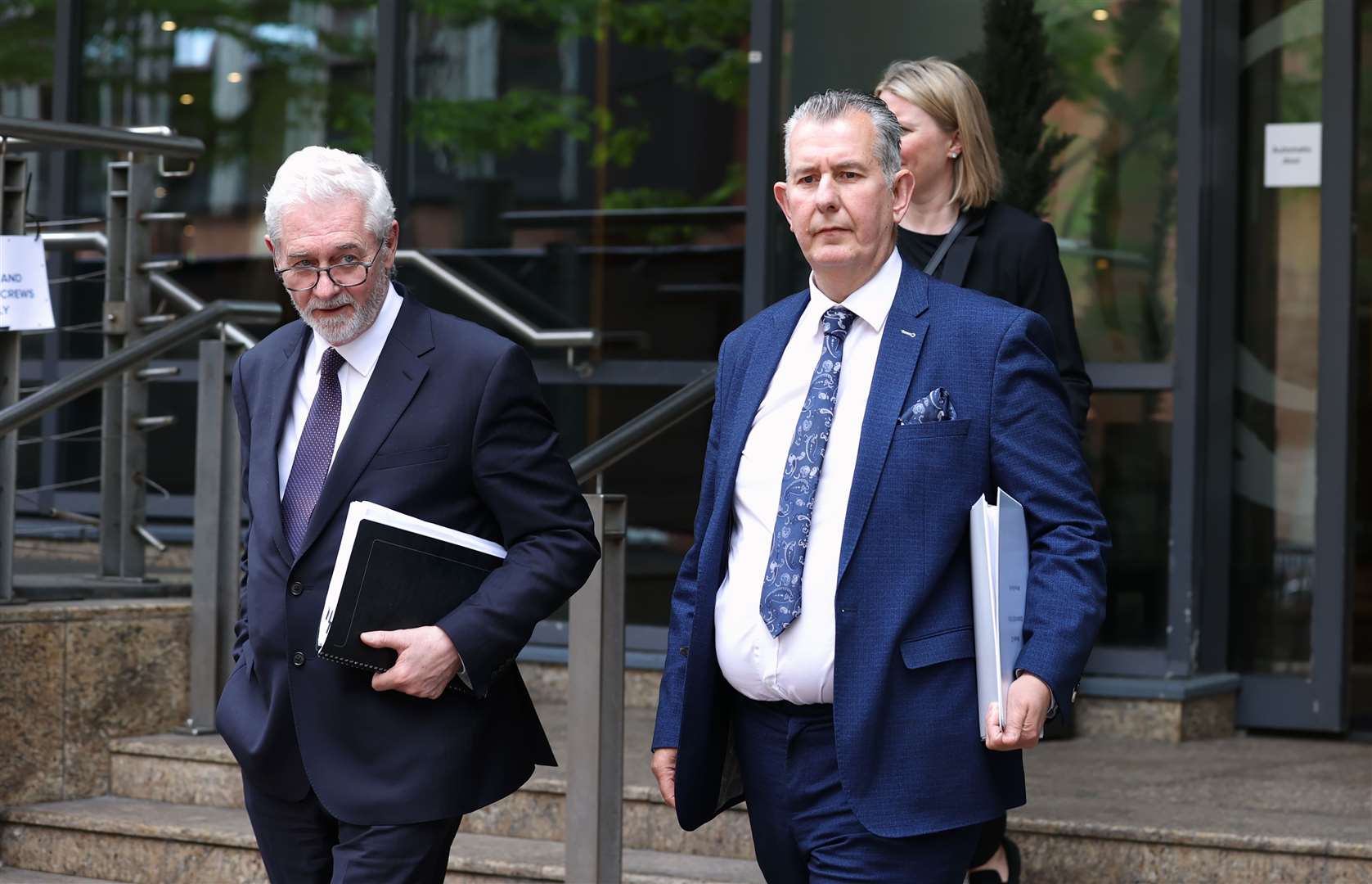 Former Stormont minister Edwin Poots (right) and solicitor John McBurney leaving the Clayton Hotel in Belfast after giving evidence at the UK Covid-19 Inquiry hearing on Thursday (Liam McBurney/PA)