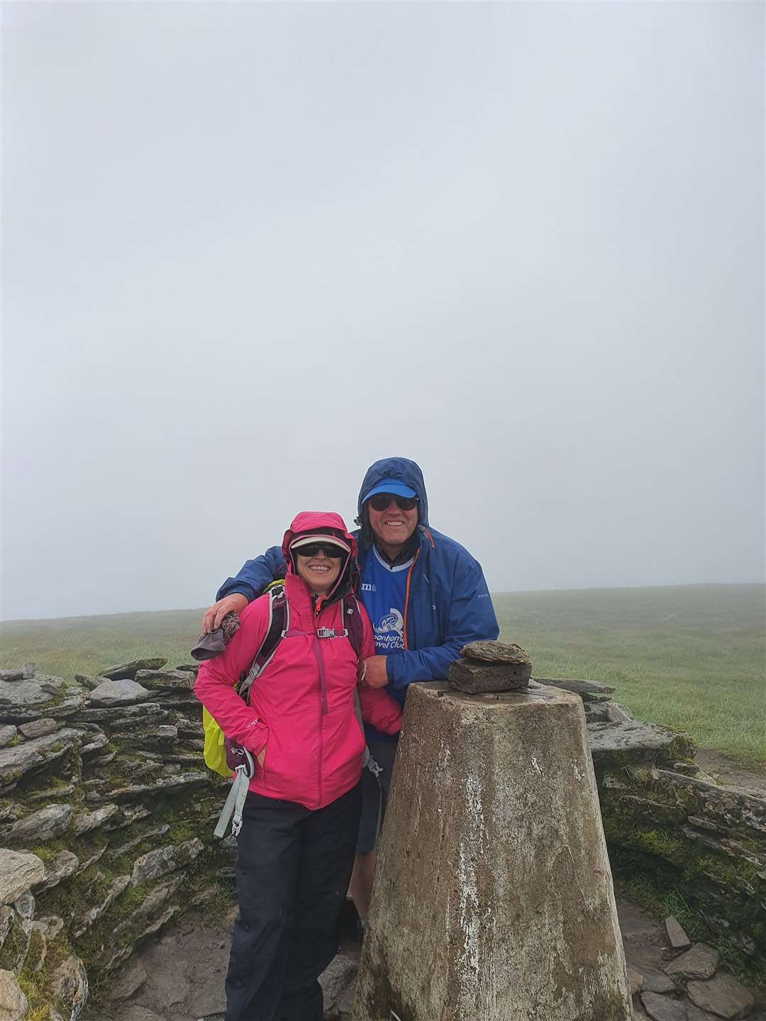 Chris and Donna celebrate their first Munro on Ben Wyvis.