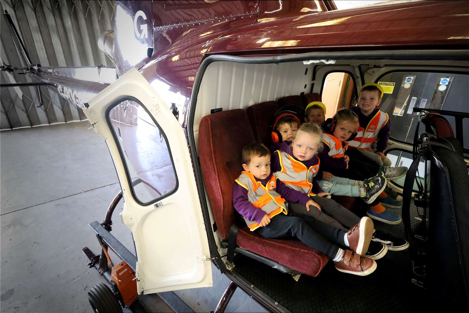 Tommy Barnett, Brodie Connell, Arla Fraser, Jackson Lee, Ozzy Clark and Brodie Mackay of Tintins Early Learning & Childcare inside one of the helicopters. Picture: James Mackenzie.