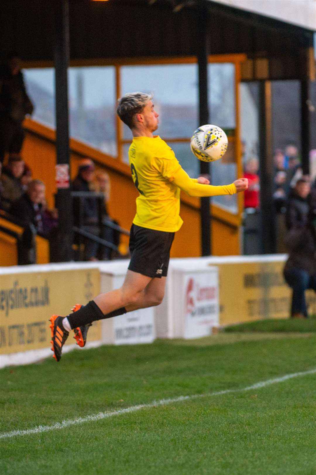 Nairn wing back Sam Gordon leaps to control a high ball against Keith. Picture: Callum Mackay