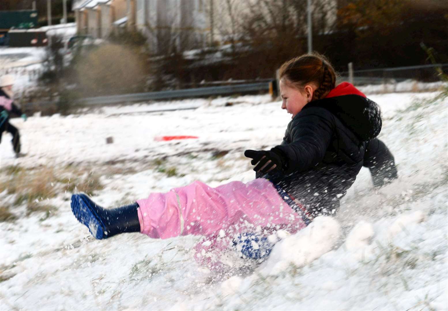 Mirabelle Tremarco didn't even need a sledge to slide in the snow. Picture: James Mackenzie