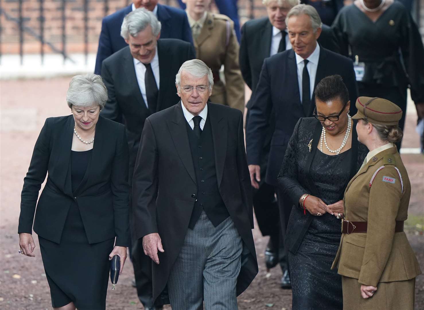 Former prime ministers Theresa May and John Major, with Commonwealth secretary-general Baroness Scotland arriving (Joe Giddens/PA)