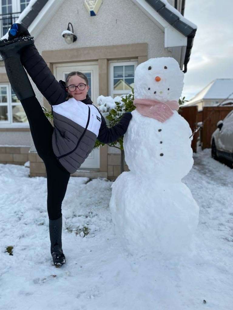 Bev Insch's photo of Chloe Insch (13) from Inshes in Inverness proudly doing a leg catch with her snowman.