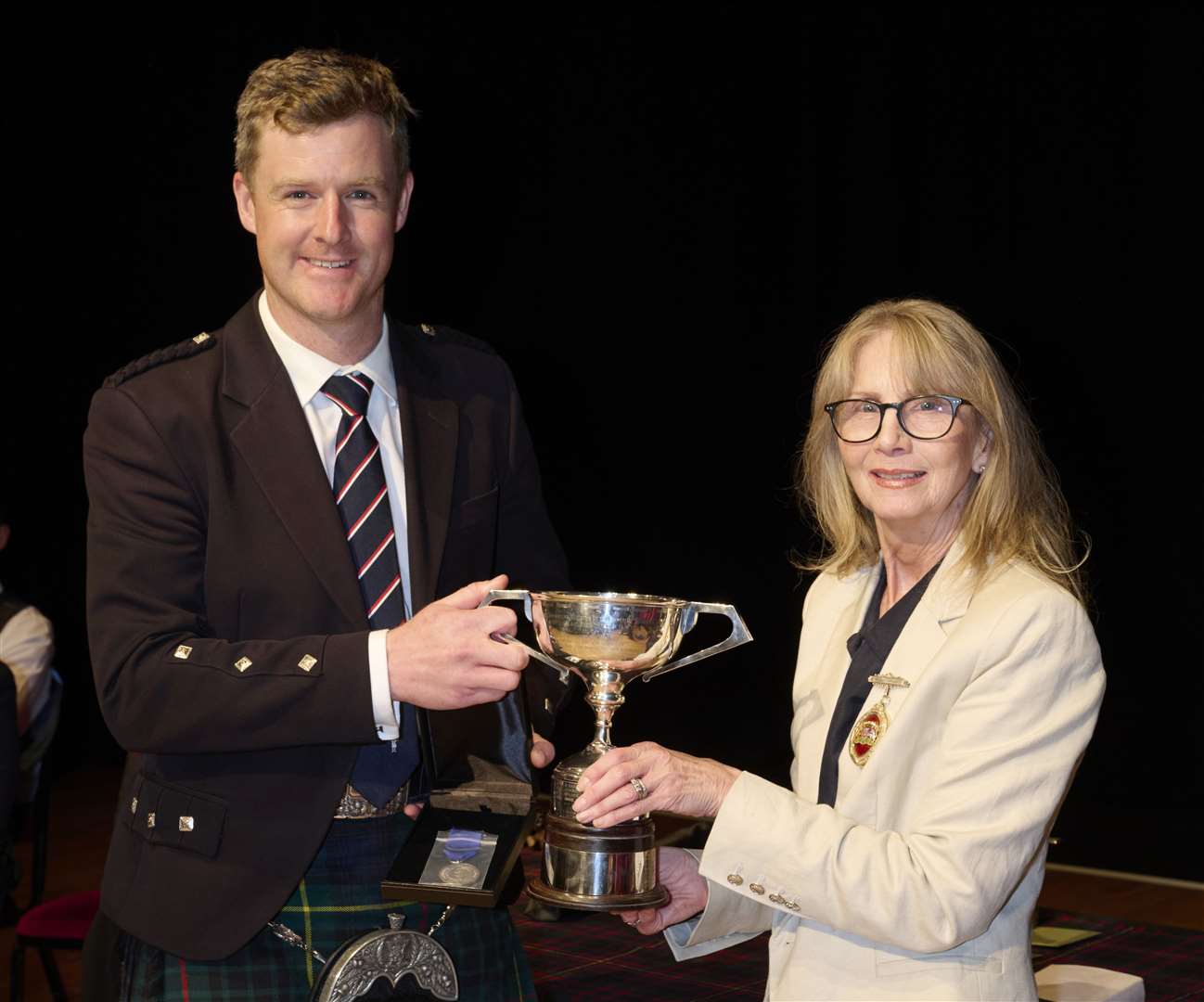 Glynis Campbell-Sinclair (the Provost of Inverness) with William Rowe who won the 1st Silver Medal at the Northern Meeting 2022 which was held at Eden Court in Inverness.