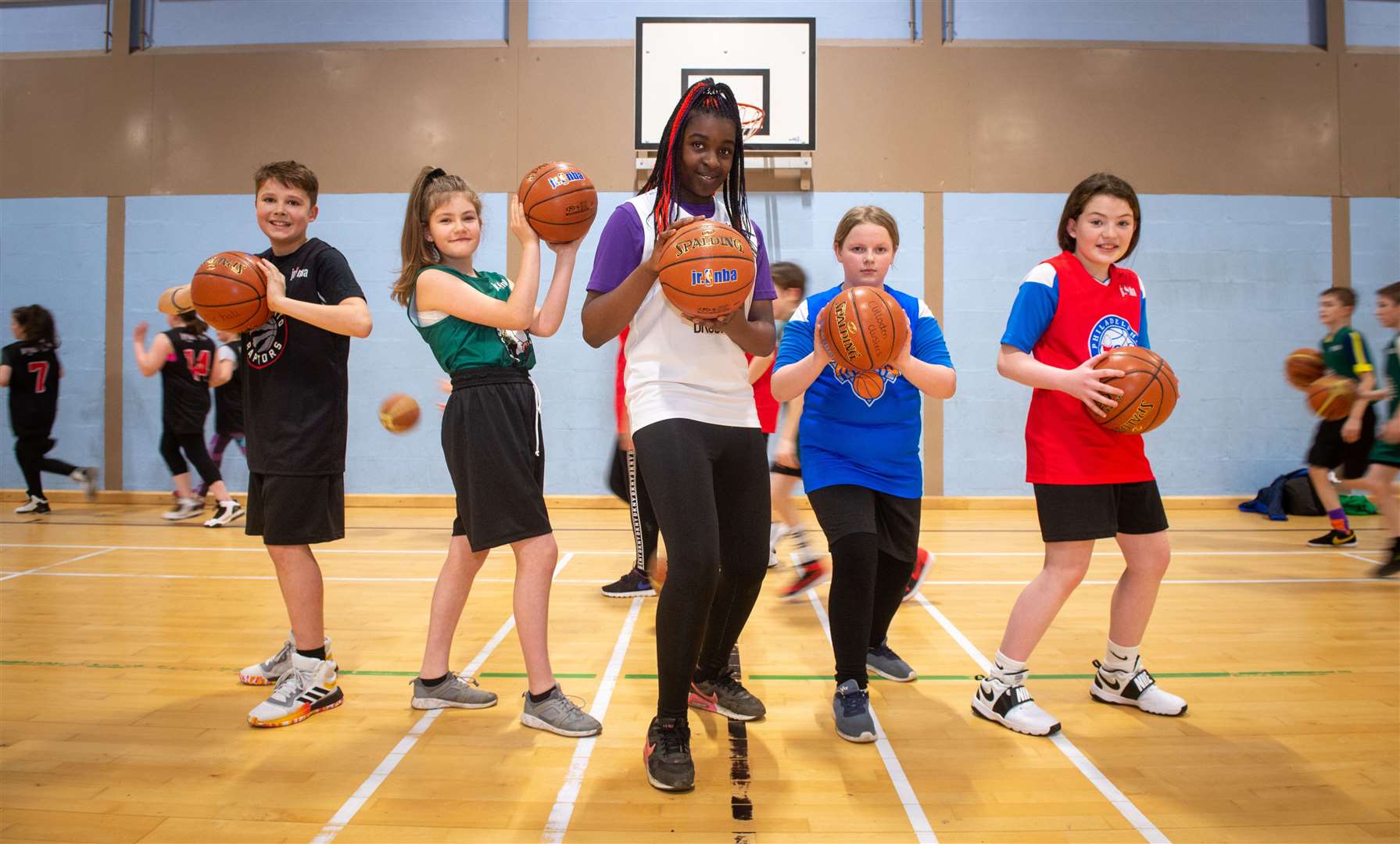 Highland Bears Basketball Club launched a training initiative with primary school kids in Inverness at Culloden Academy. They were presented with basketball strips...Modeling the new strips are Oliver Lamont, Julka Szewczak, Hilary Ugheli, Olivia Brechin and Charlotte Alexander...Picture: Callum Mackay..