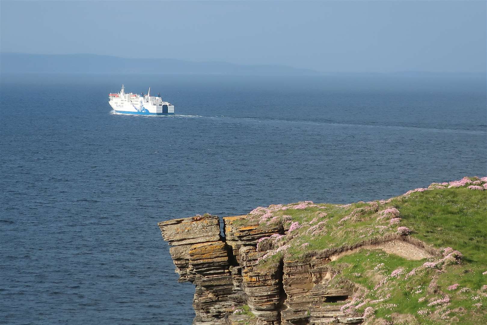 The NorthLink ferry heads out of Thurso Bay towards Orkney. Picture: John Davidson
