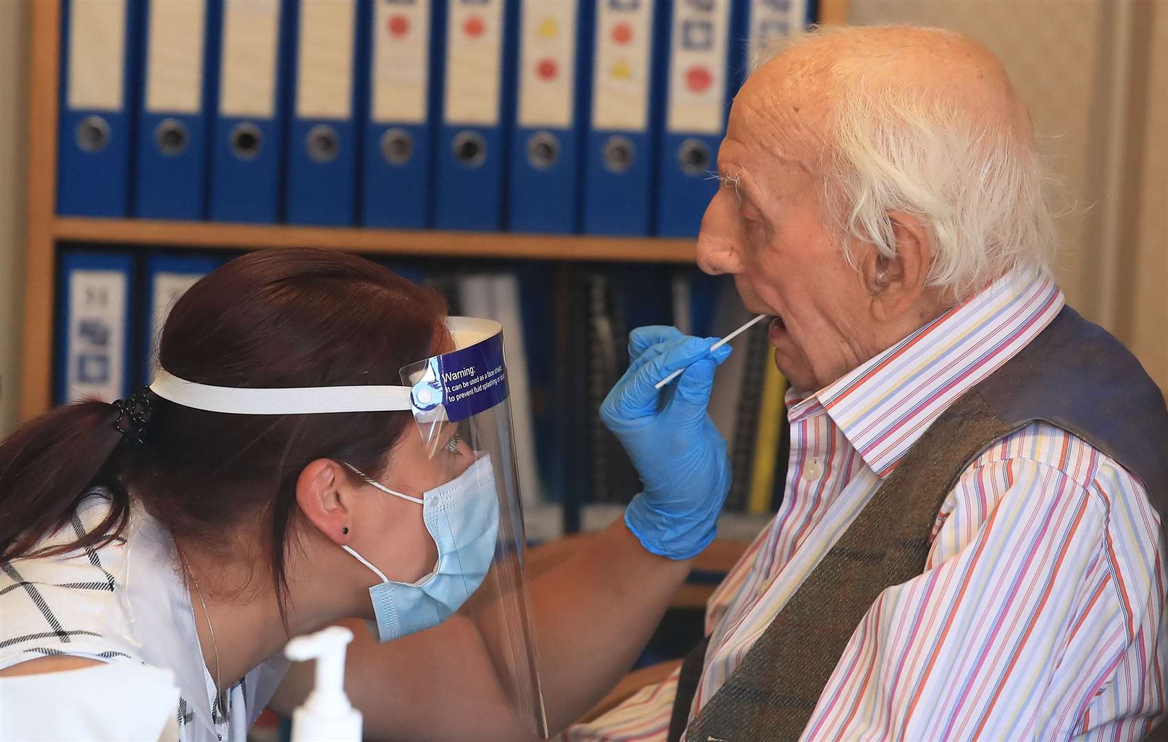 A resident being tested for coronavirus in a care home (PA)