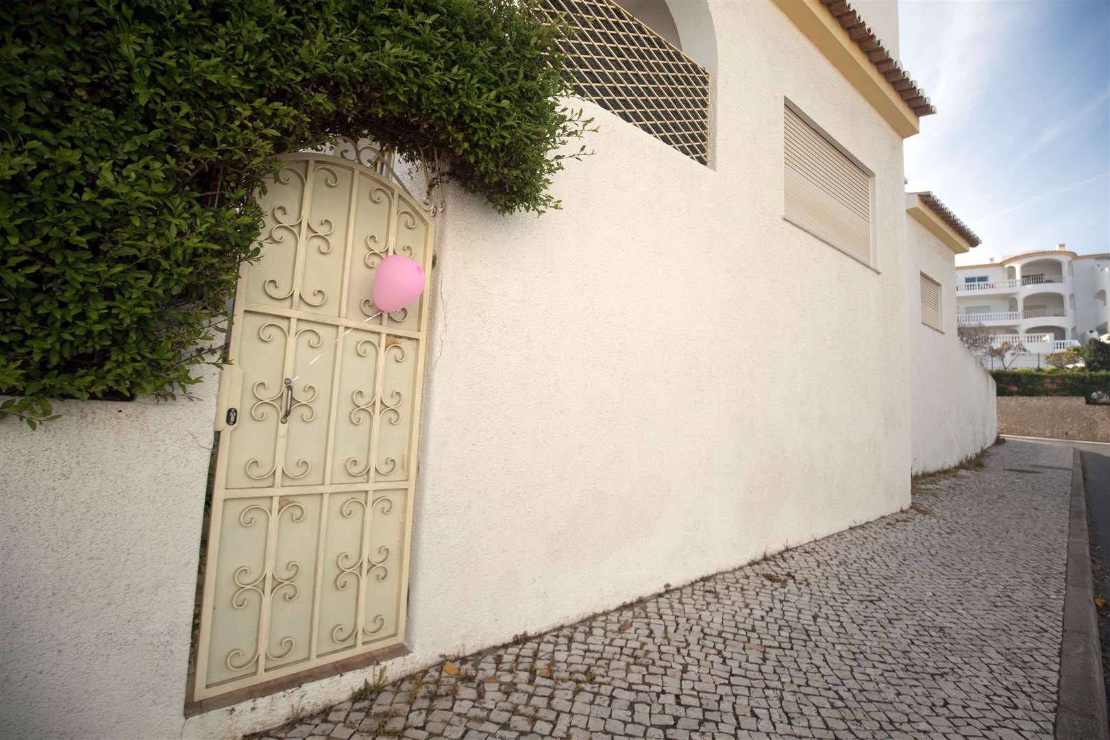 A pink balloon outside apartment 5A on Rua Dr Agostinho da Silva in Praia Da Luz, Portugal, where Madeline McCann went missing (PA)