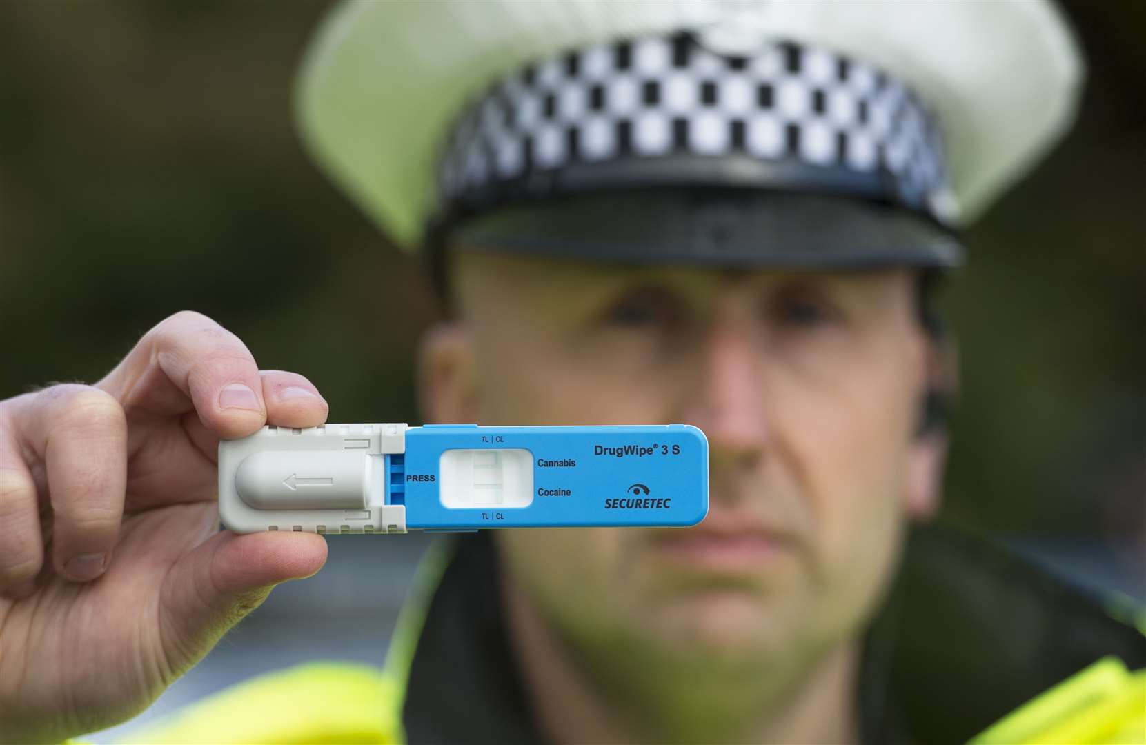 Officer with a roadside drugs test.