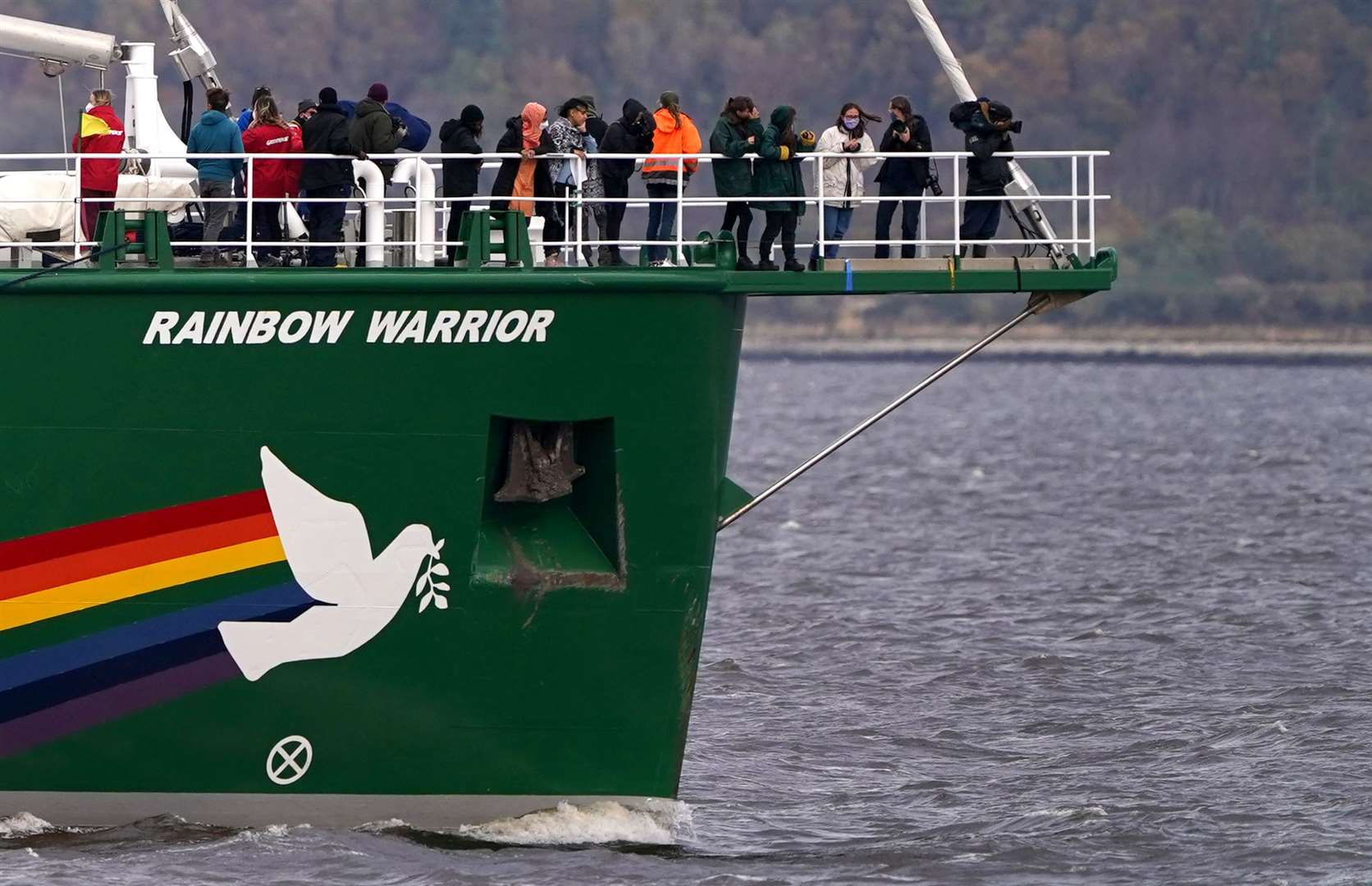 Activists on board the Rainbow Warrior as it makes its way towards Cop26 in Glasgow (Andrew Milligan/PA)