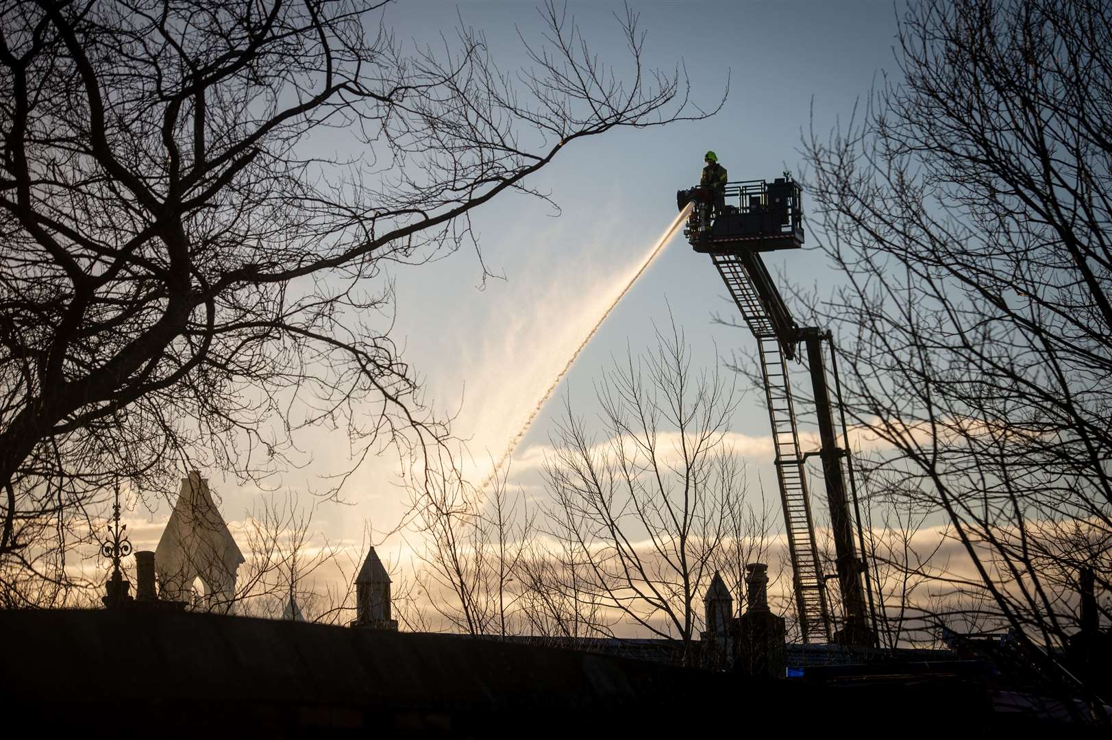 Firefighters dousing the latest fire at Park Primary School, Invergordon. Picture: Callum Mackay.