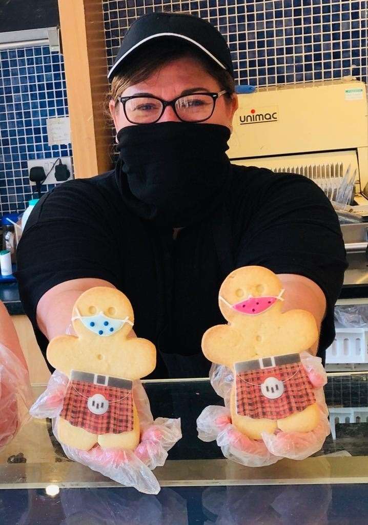 A member of Ashers staff shows off the new shortbread range.