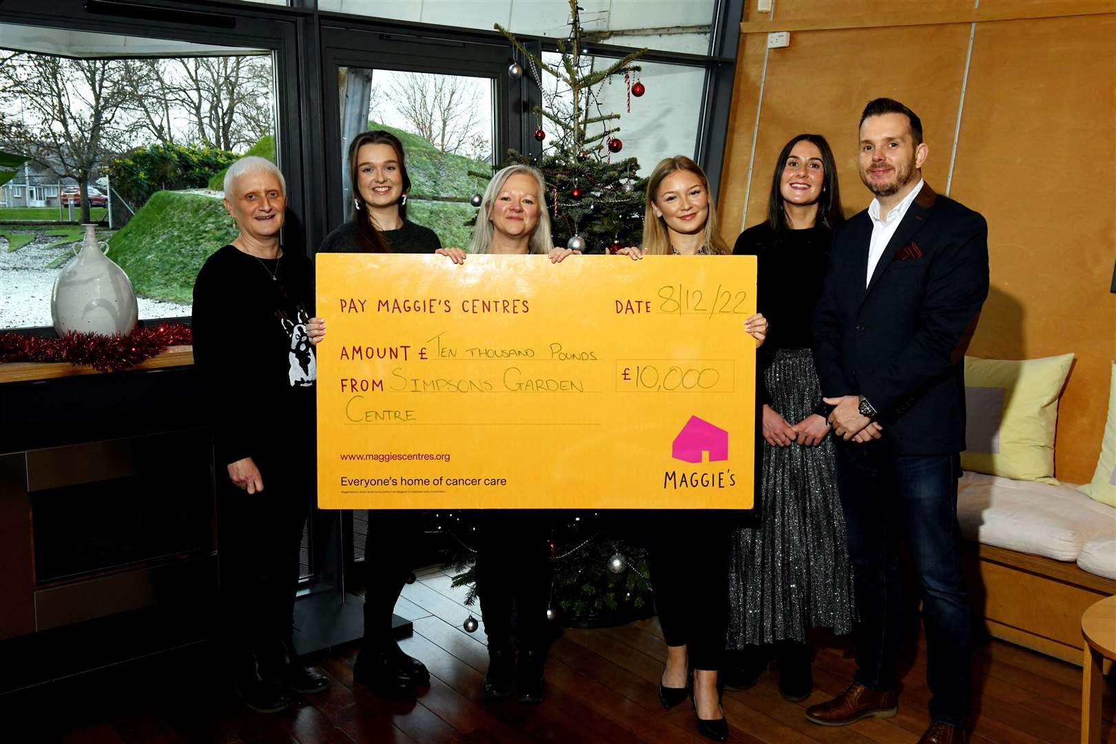 Janet Campbell, Lucy Taylor, and Siobhan Macbean, from Simpsons, presenting the £10,000 cheque to Mia Pimm, Katriona Statham, and Andrew Benjamin from Maggies Highland. Picture: James Mackenzie