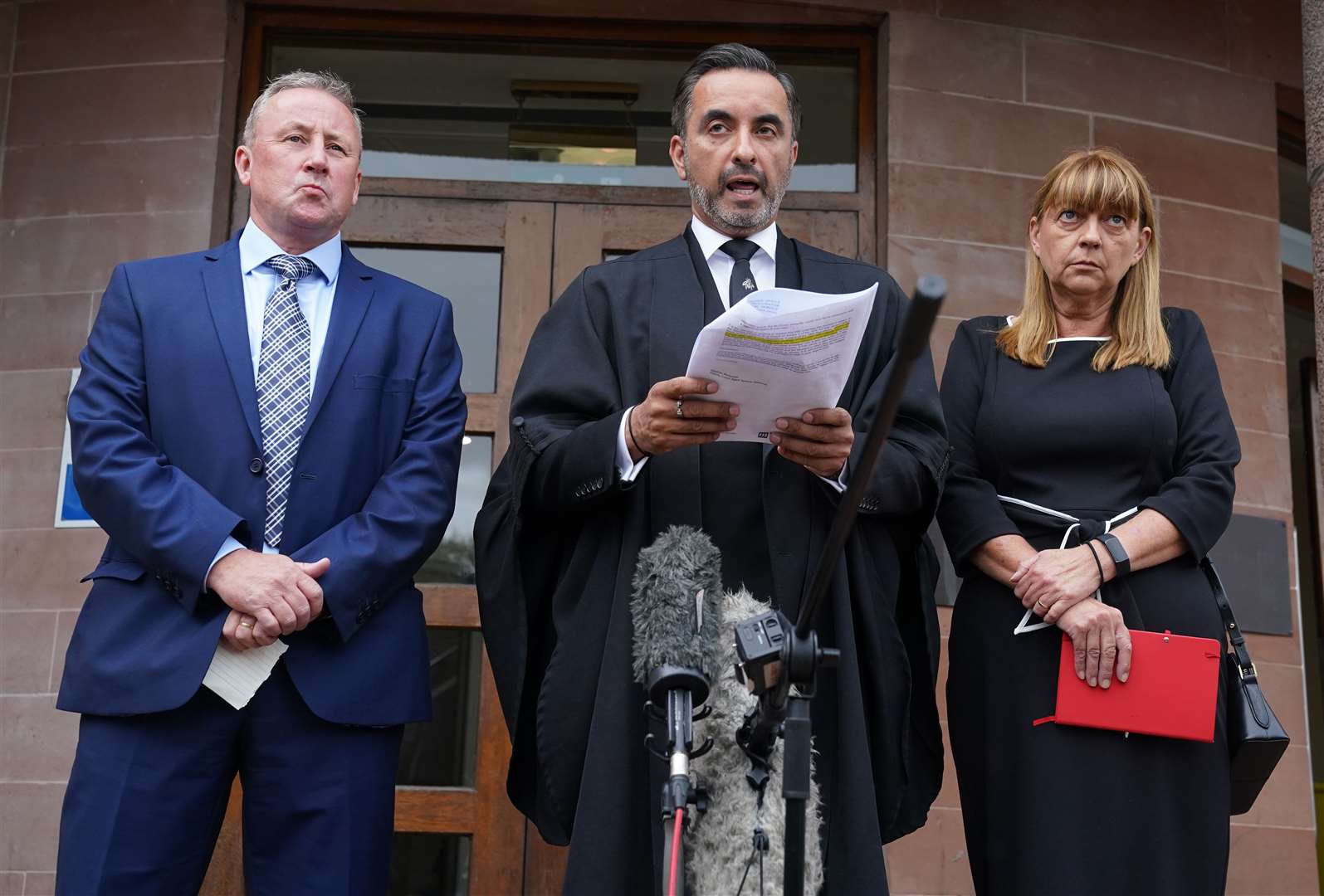 Katie Allan’s parents, Linda and Stuart, pictured with solicitor Aamer Anwar, centre (Andrew Milligan/PA)