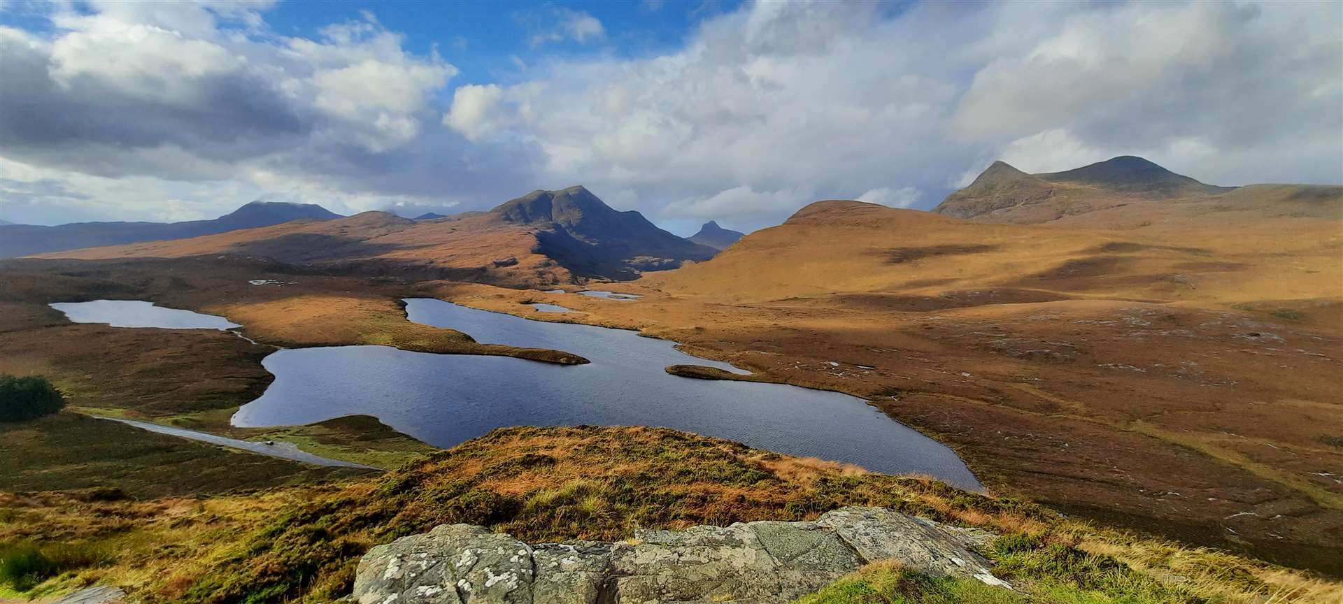 The view from the top of the crag over Lochan an Ais to Cul Beag. Stac Pollaidh and Cul Mor.