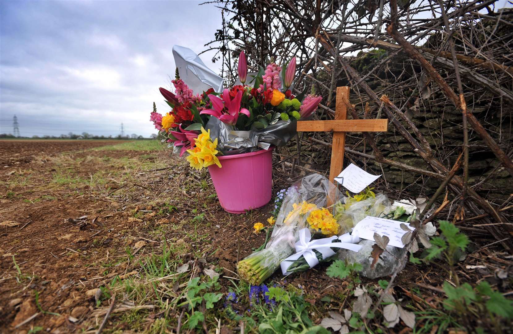 Tributes left at the field where Miss Godden’s body was found (Time Ireland/PA)