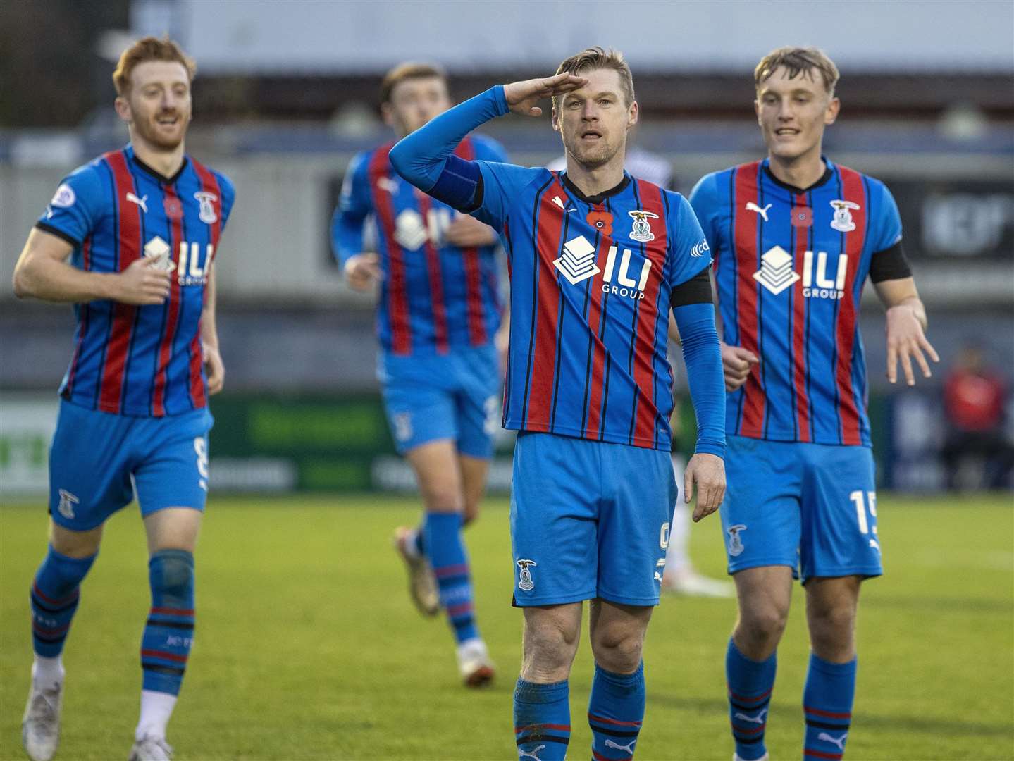 Picture - Ken Macpherson. ICT’s Billy McKay celebrates with a Remembrance Day salute to home fans after scoring from the penalty spot.