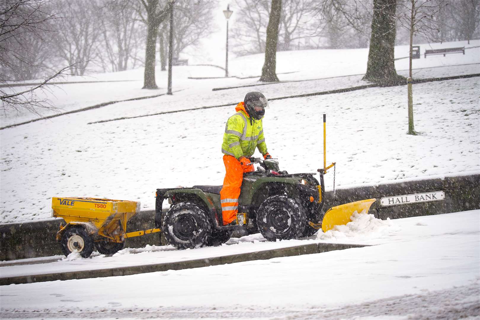 A snowplough clears a path in Buxton, Peak District (Peter Byrne/PA)